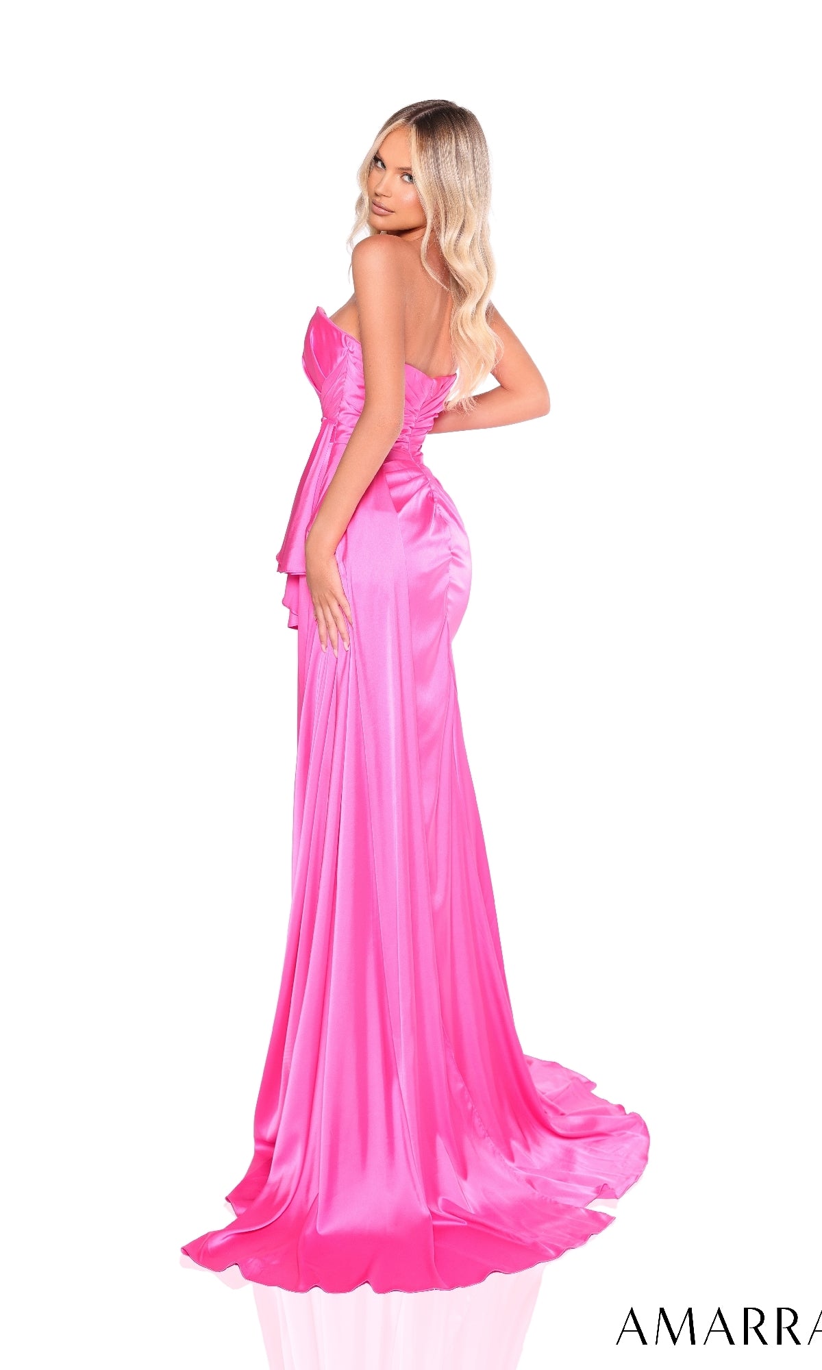 A woman with long blonde hair models the Amarra 88206, a bright pink satin strapless prom dress with a sweetheart neckline and slight train, standing against a white background.